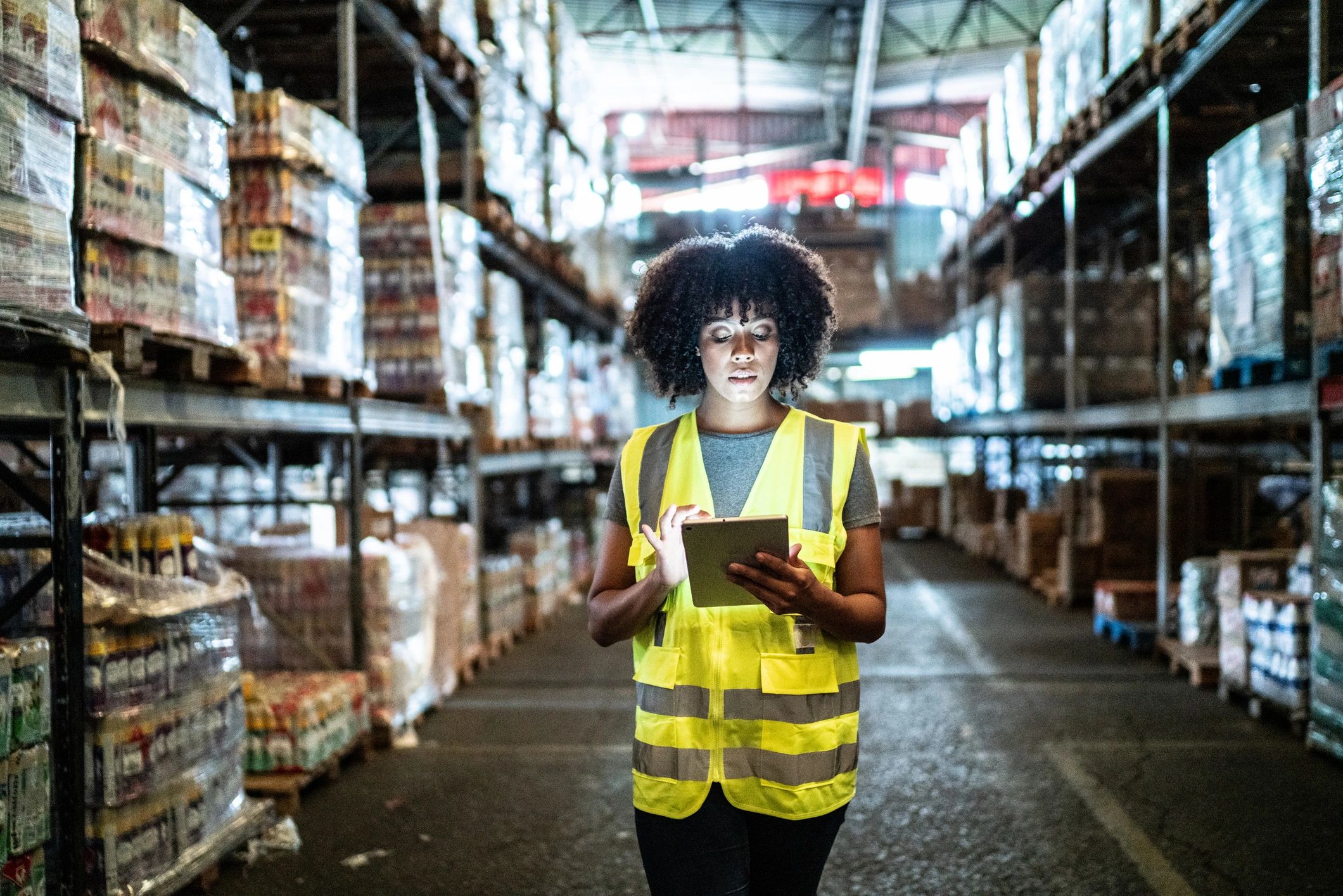 Warehouse staff using a tablet for inventory management