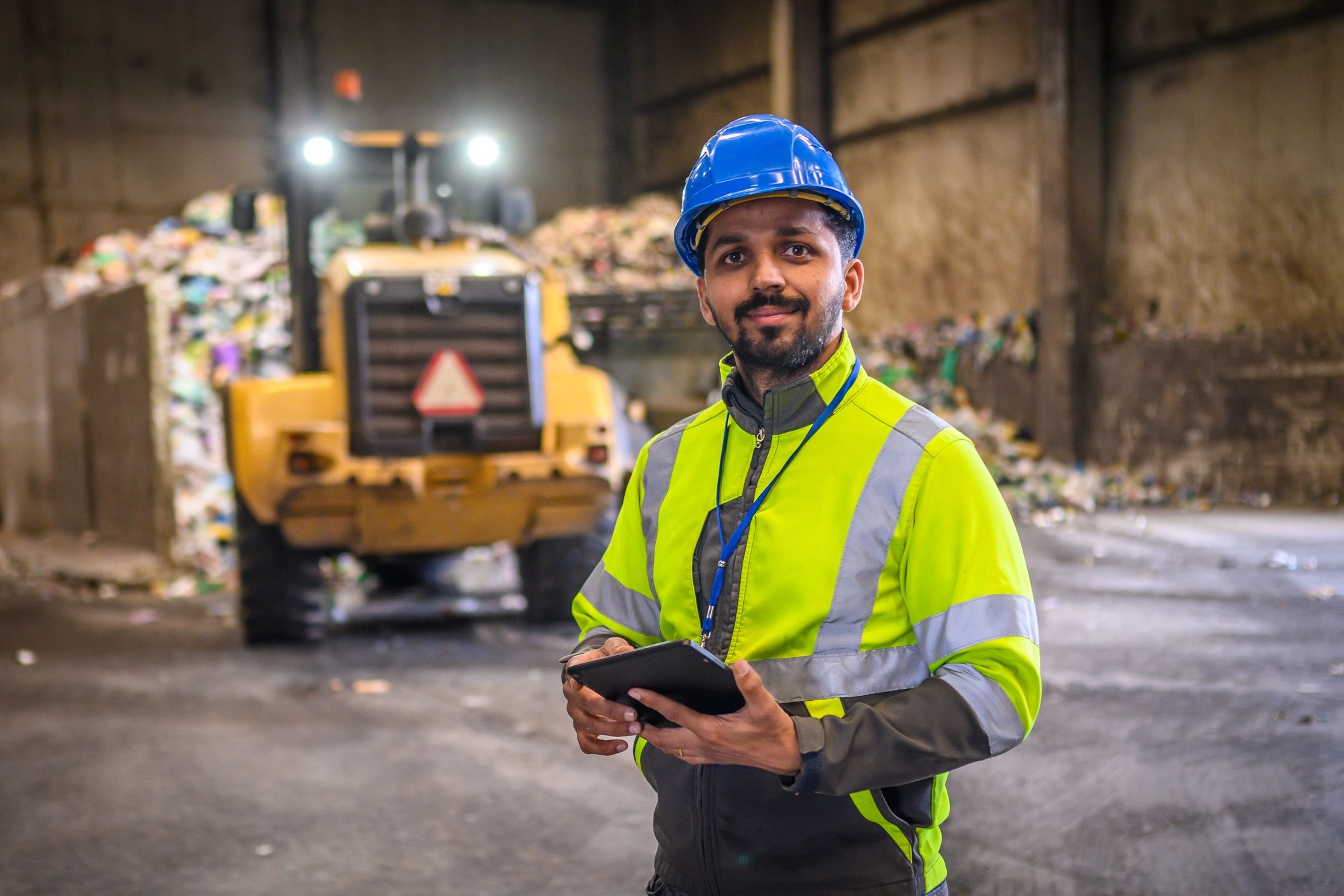 Quality inspection professional in a warehouse using a tablet
